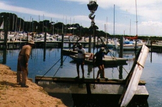 Righting an over-turned pontoon. The attached dinghy was supposed keep it upright